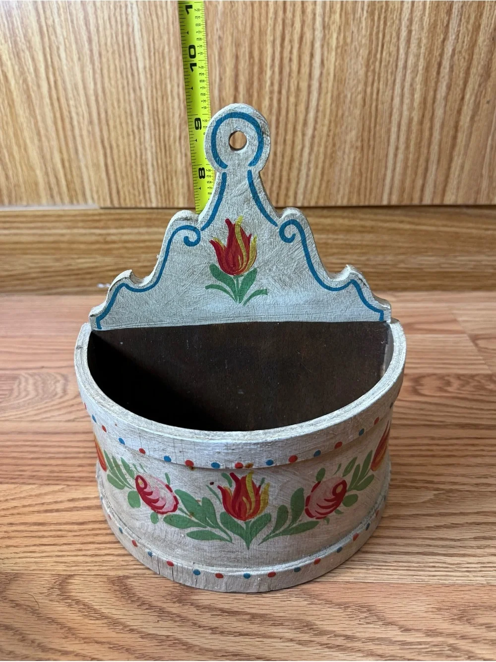 A wooden wall box for farmhouse decor,featuring hand-painted floral designs